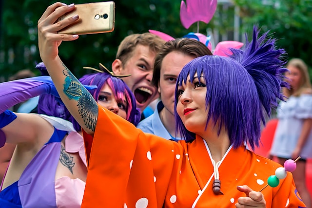fans in cosplay taking a selfie